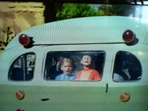 Buffy and Jody in back window of bus
