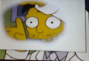 Dr. Nick looks through grease spot