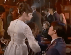 Moondoggie yanks Gidget's arm